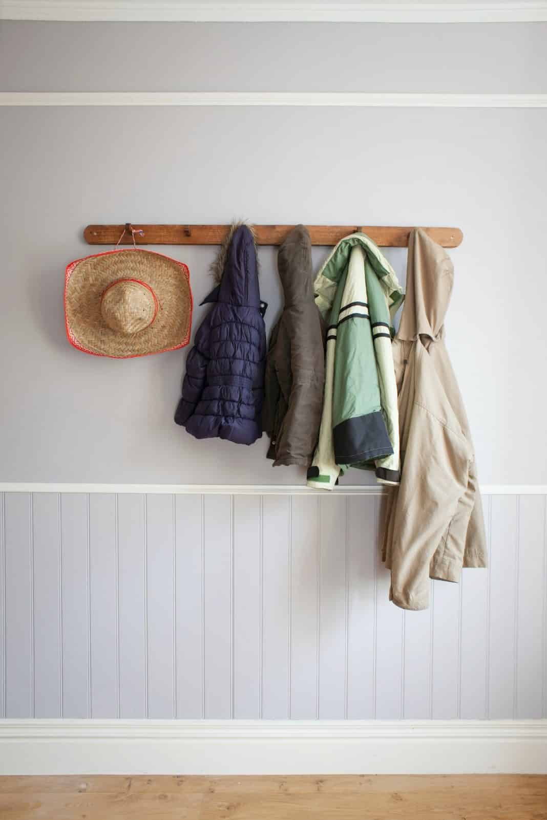 Coats and hat on coat rack