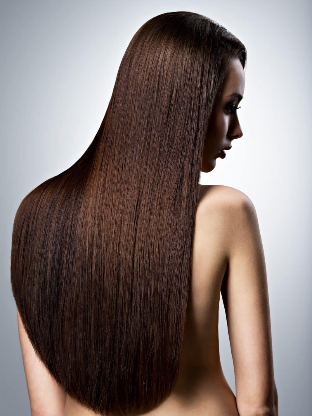 Portrait of beautiful woman with long straight brown hair